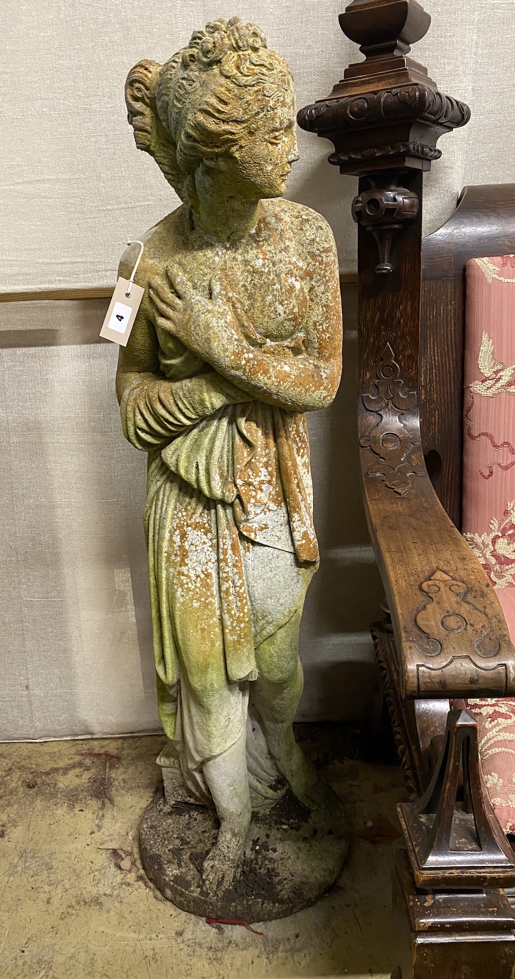 A reconstituted stone garden statue of a female bather, height 117cm